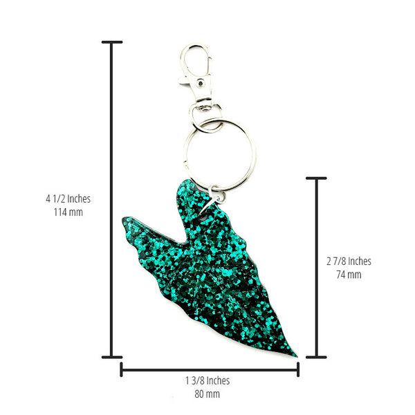 All Up In The Hair | Online Accessory Boutique Located in Mooresville, NC | Our Alocasia Leaf Keychain on a white background. The measurements for the keychain are written on the image.