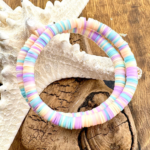 All Up In The Hair | Online Accessory Boutique Located in Mooresville, NC | Two pastel heishi bracelete laying on a piece of driftwood and a starfish.