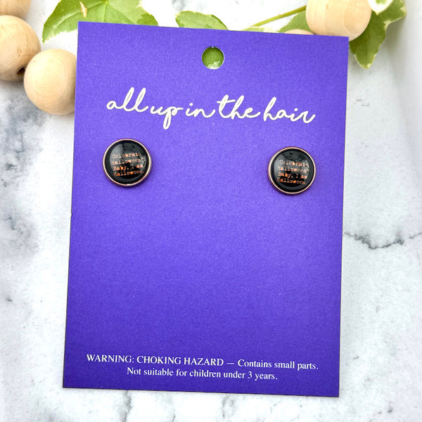 All Up In The Hair | Online Accessory Boutique Located in Mooresville, NC | Two "I Am Halloween " earrings on an indigo colored, All Up In The Hair branded packaging card. The card is laying on a white marble background.