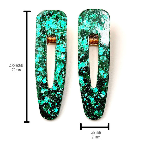 All Up In The Hair | Online Accessory Boutique Located in Mooresville, NC | Two green barrettes laying on a plain white background. The measurements of the barrettes are written to the left of the left barrette and under the right barrette.