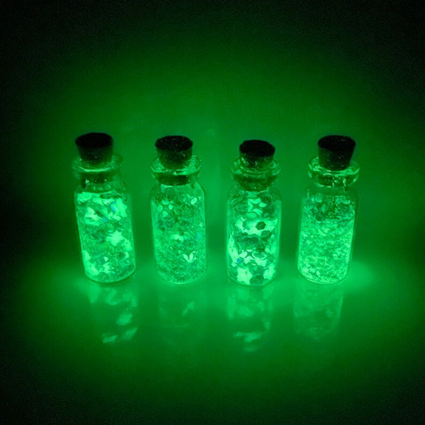 All Up In The Hair | Online Accessory Boutique Located in Mooresville, NC | Four small jars glowing bright green.