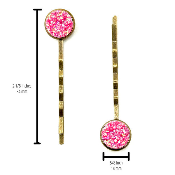 All Up In The Hair | Online Accessory Boutique Located in Mooresville, NC | Two Pink Spineal Druzy Bobby Pins on a plain white background. The measurements of the bobby pins are written to the side of the left bobby pin and under the right bobby pin.