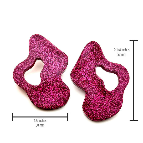 All Up In The Hair | Online Accessory Boutique Located in Mooresville, NC | Two Pink Wave Earrings on a white background. The measurements of the earrings are written under the left earrings and next to the right earring.