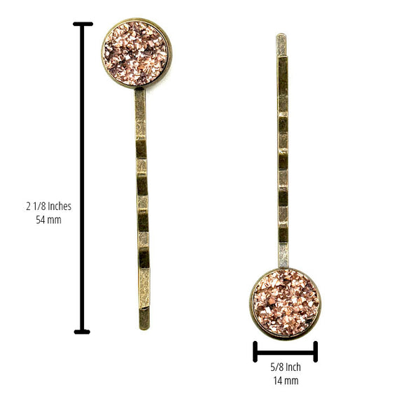 All Up In The Hair | Online Accessory Boutique Located in Mooresville, NC | Two Rose Gold Druzy Bobby Pins on a plain white background. The measurements for the bobby pins are written to the side of the left bobby pin and under the right bobby pin.