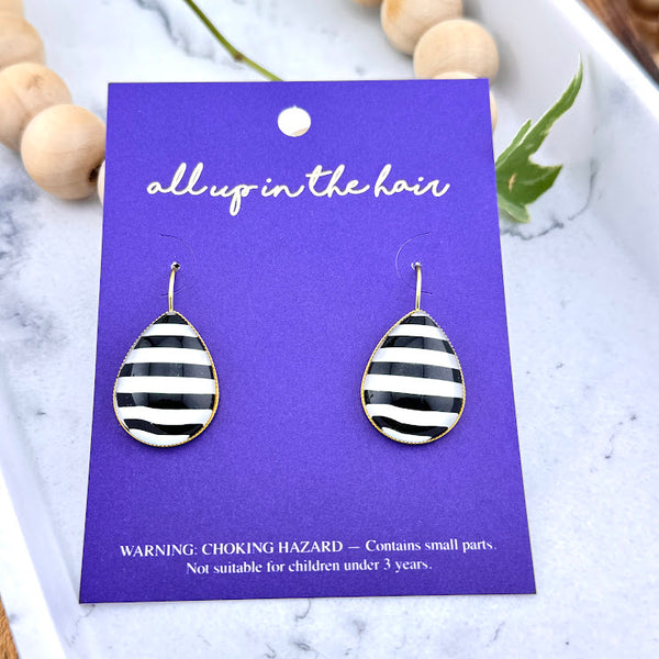 All Up In The Hair | Online Accessory Boutique Located in Mooresville, NC | Two Stripe Teardrop Earrings on an indigo colored, All Up In The Hair branded packaging card. The card is laying on a white marble background.