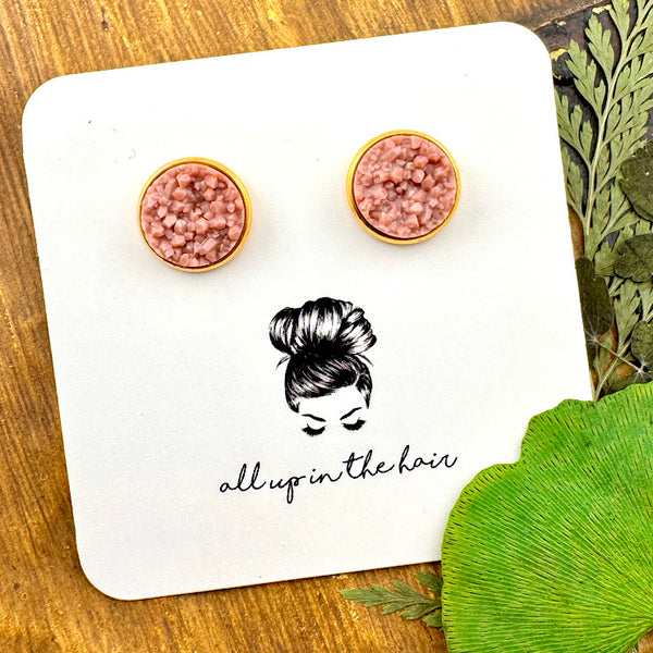 All Up In The Hair | Online Accessory Boutique Located in Mooresville, NC | Two taupe druzies set in a gold earring setting. The earrings are on a white, All Up In The Hair branded packaging card. The card is on a wood background alongside green leaves.