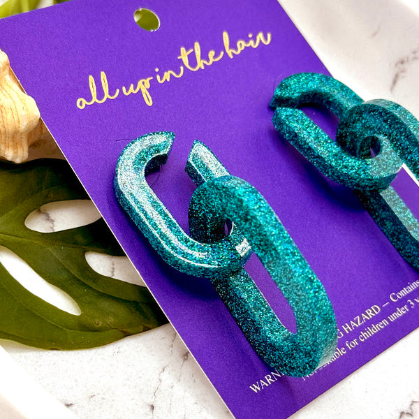 All Up In The Hair | Online Accessory Boutique Located in Mooresville, NC | Side view of two Teal Chain Earrings on an indigo backer card.