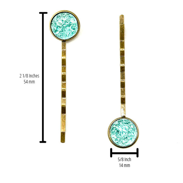 All Up In The Hair | Online Accessory Boutique Located in Mooresville, NC | Two Teal Druzy Bobby Pins on a white background. The measurements of the bobby pins are written to the side of the left bobby pin and under the right bobby pin.