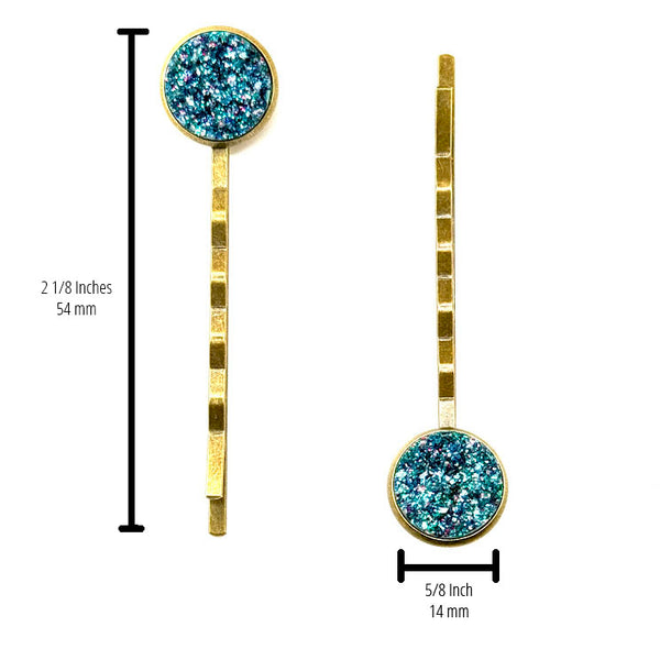 All Up In The Hair | Online Accessory Boutique Located in Mooresville, NC | Two Teal Glitter Druzy Bobby Pins on a white background. The measurements of the bobby pins are written to the left of the left bobby pin and under the right bobby pin.