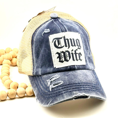 All Up In The Hair | Online Accessory Boutique Located in Mooresville, NC | Denim Blue Baseball Cap with a white patch that says "Thug Wife". The hat is sitting on a white background.