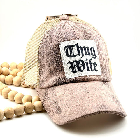 All Up In The Hair | Online Accessory Boutique Located in Mooresville, NC | A rose gold baseball cap with a white patch that says Thug Wife in black.